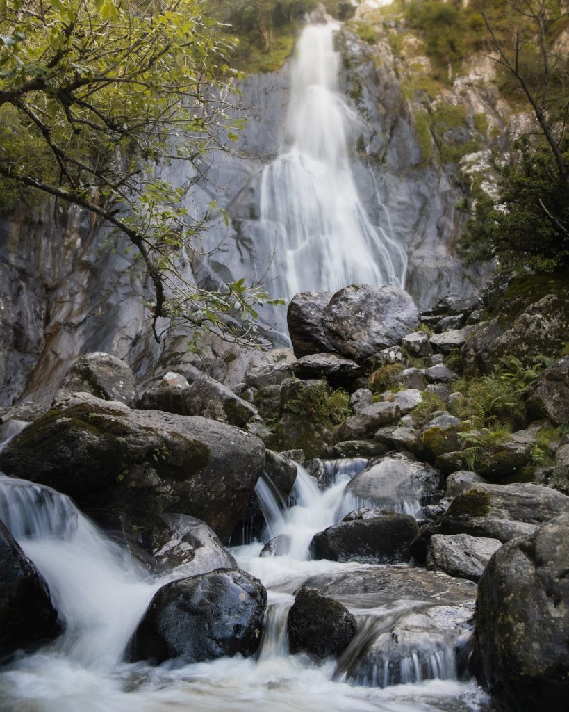 Waterfall and a stream flowing through the rocks